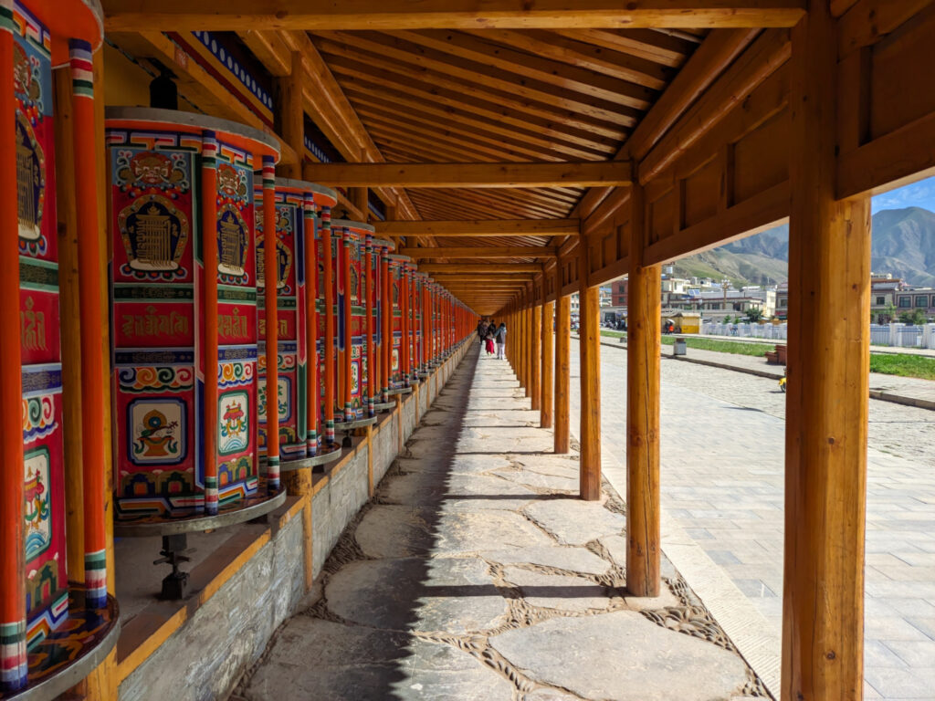 A corridor with mani wheels on the wall.